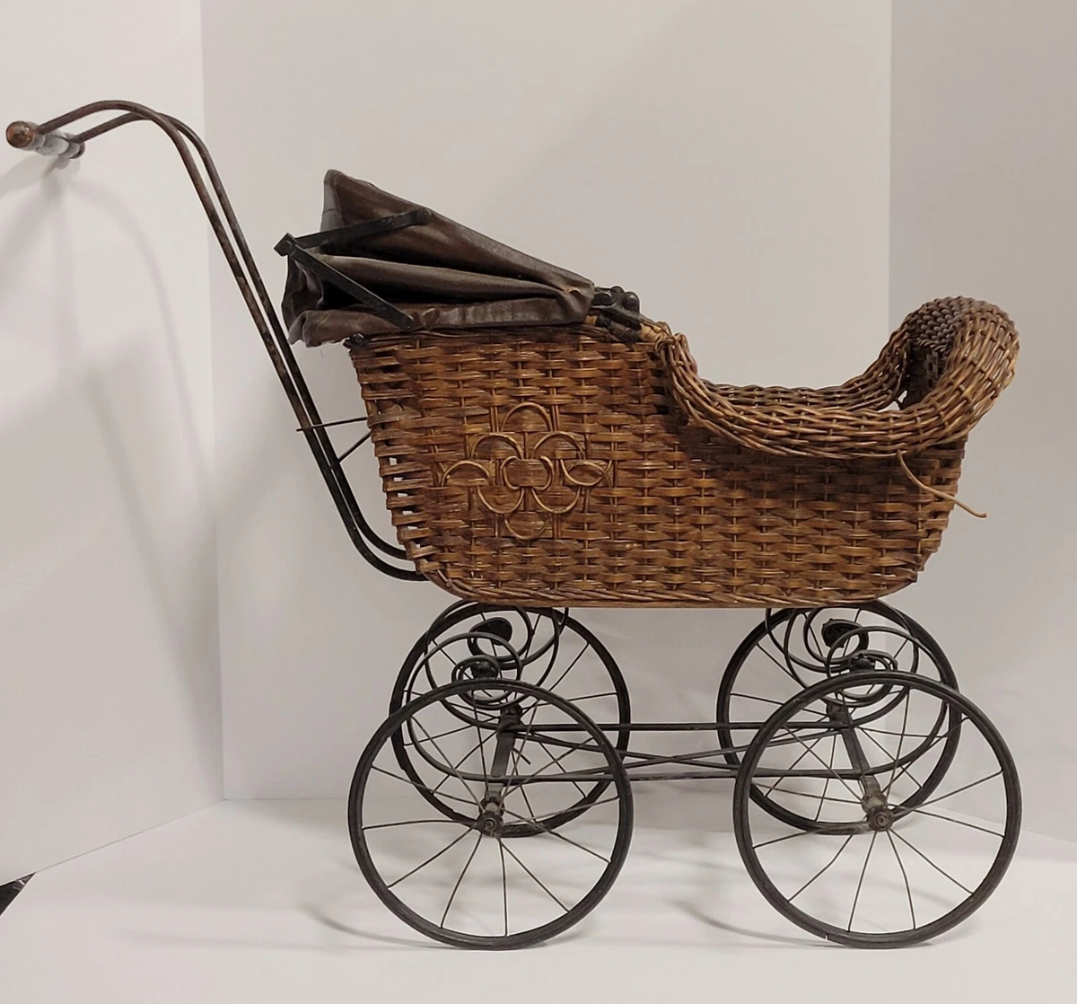 Antique Doll Carriage Wicker body metal wheels support