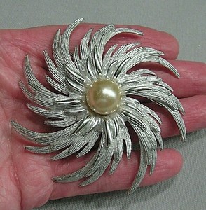 large silver brooches and pins