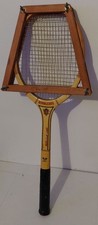 Vintage Spalding "Wimbledon" wooden tennis racket with a wooden racket press.