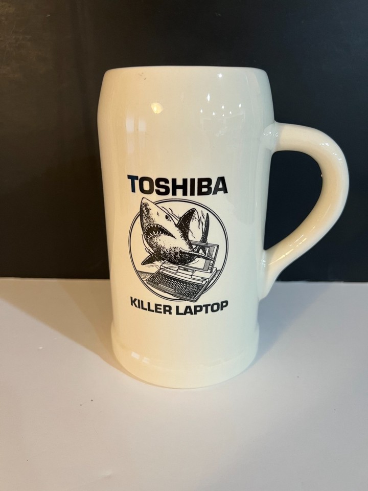 A 90s Toshiba promo beer stein with a SHARK graphic and 'Killer Laptop' branding — peak aggressive 90s tech marketing on a collectible drinkware piece that's genuinely hilarious.