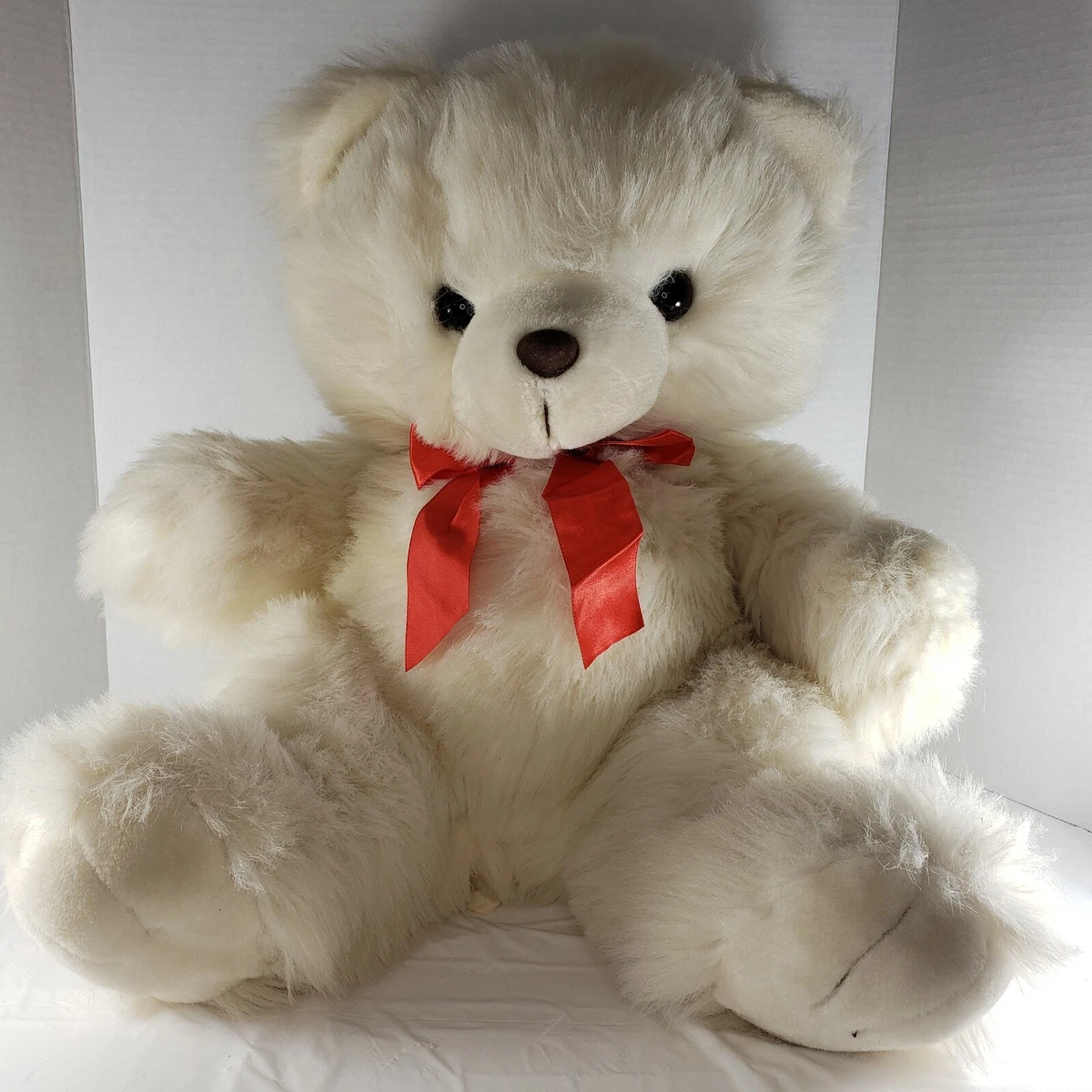 White teddy bear with red deals bow