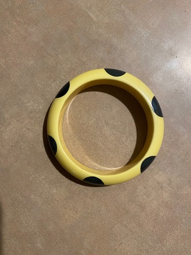 Vintage bakelite bangle , signed Brad El Frink, ivory color with black red dots