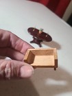 Miniature Dollhouse Table With Decor Attached And Unfinished Wood Sofa — photo 2