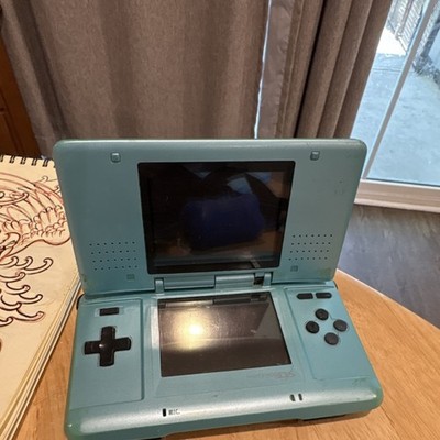 Nintendo DS Teal Dual Screen Handheld Console  (unsure if it functions)