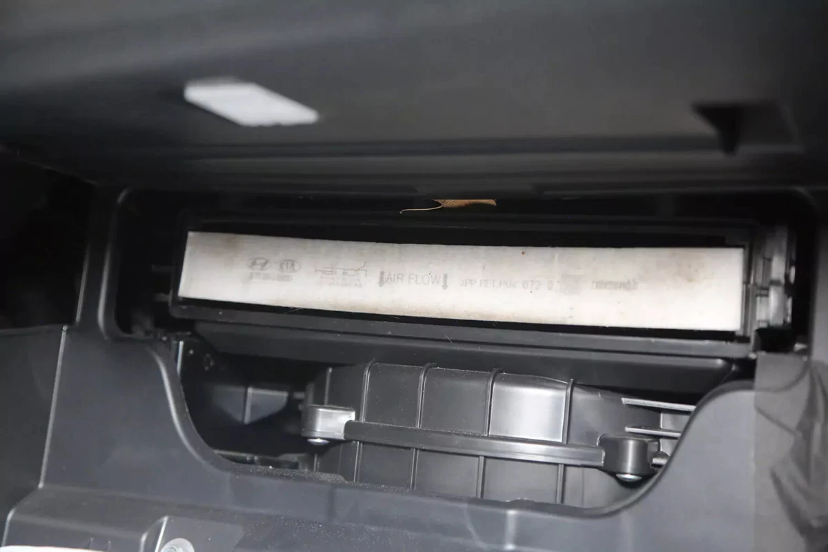 The cabin air filter exposed after the door cover is opened.