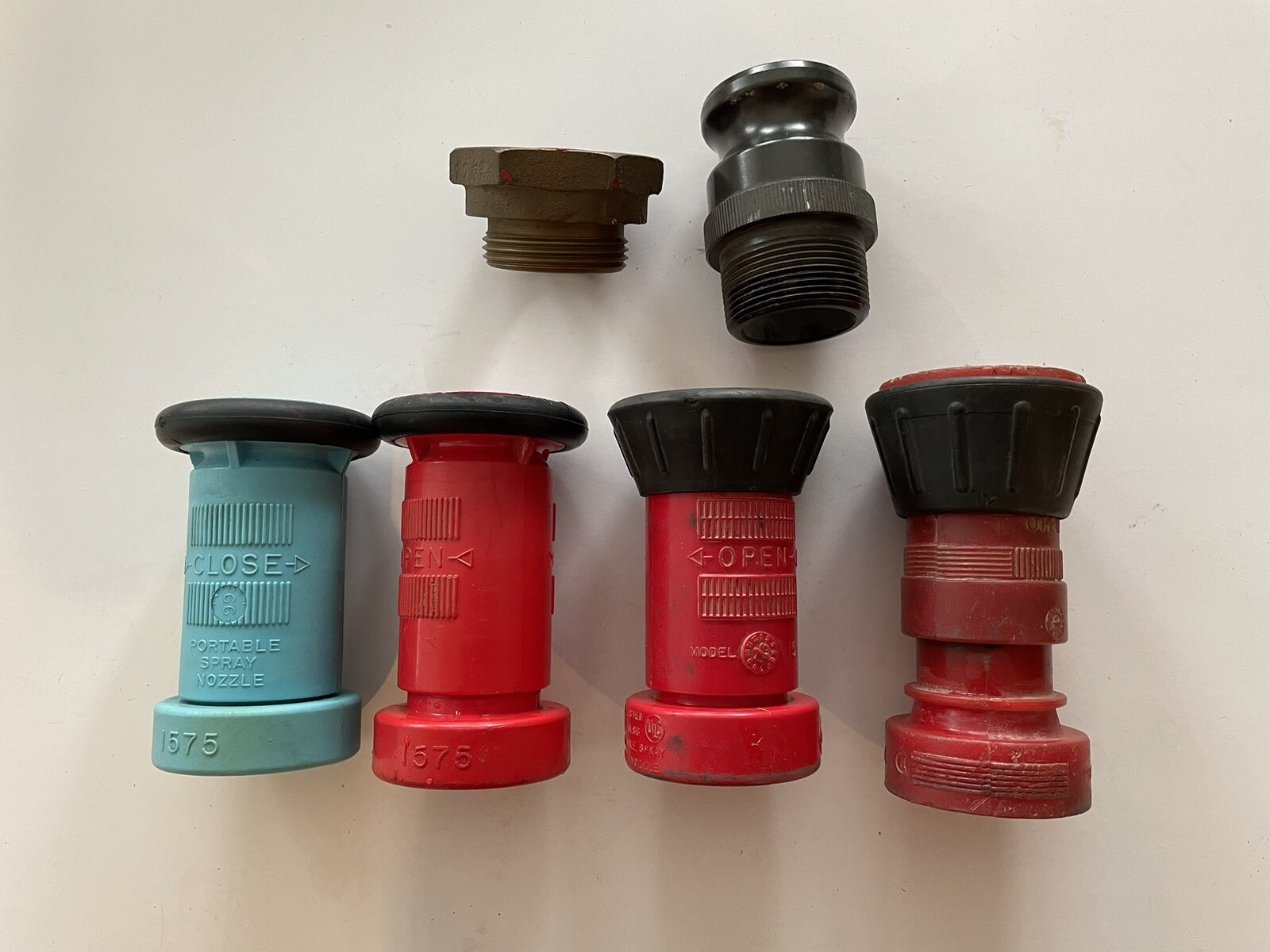 4 used 1  1/2” Fire Hose Nozzles and 2 Fittings