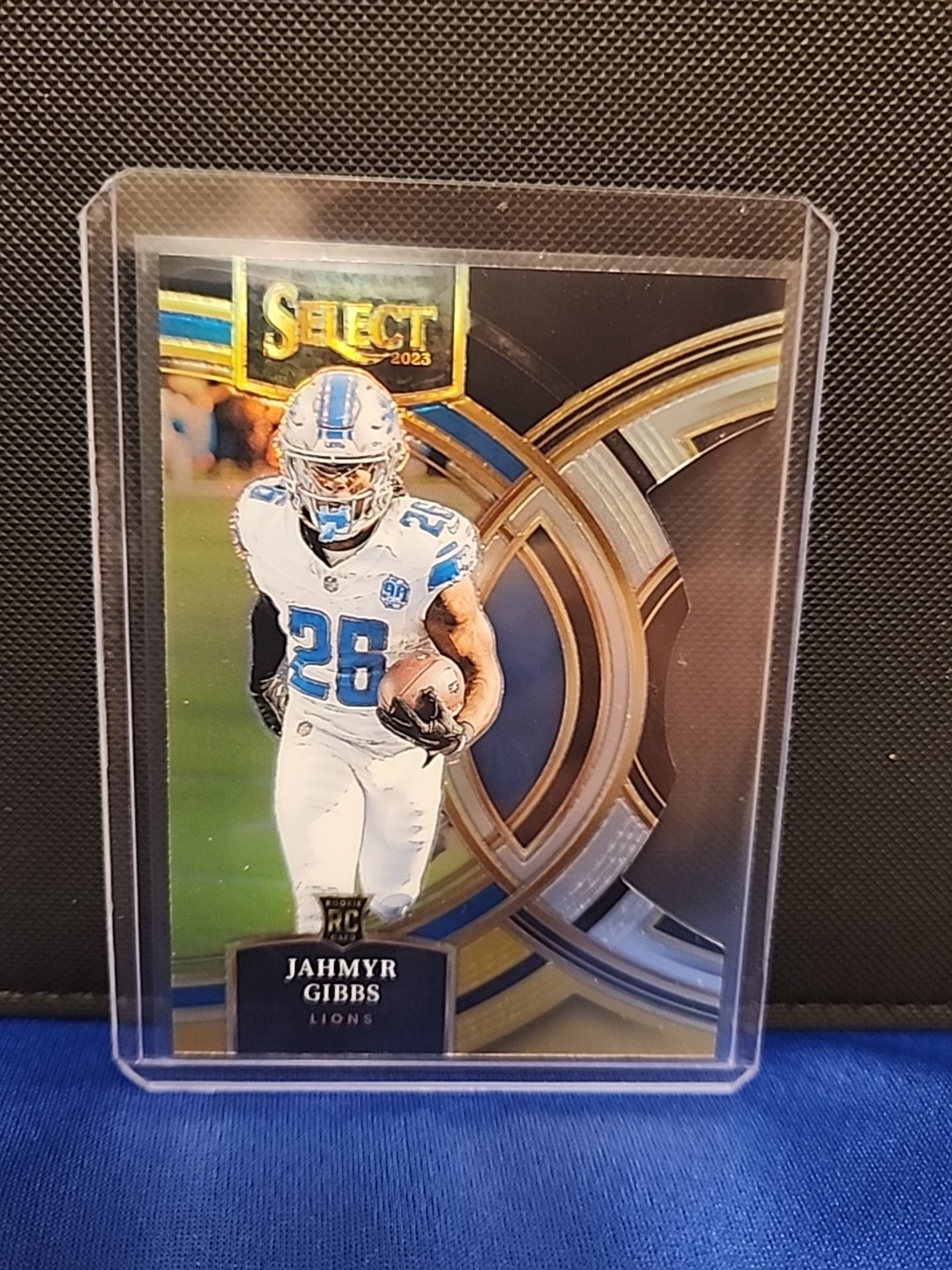 2023 Panini Select Premier Level Jahmyr Gibbs Rookie Black & Gold Prizm Die-Cut