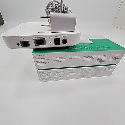 White Eero 6+Plus dual band mesh WiFi router with black casing, visible rear Ethernet ports, and green box with product label.