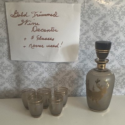 Glass decanter with 5 glasses gold trim never been used with mouse design 
