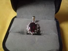 10K Yellow Gold Ladies Garnet & 3-Diamond Pendant       1.7 grams