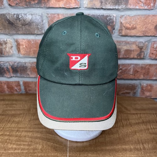 Green vintage Dairyland seed strapback hat with red and white embroidered logo and red stripe accents on the front panel.