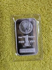 Highland Mint 1 oz. Morgan Design Silver Bar, which is a collectible silver BU.