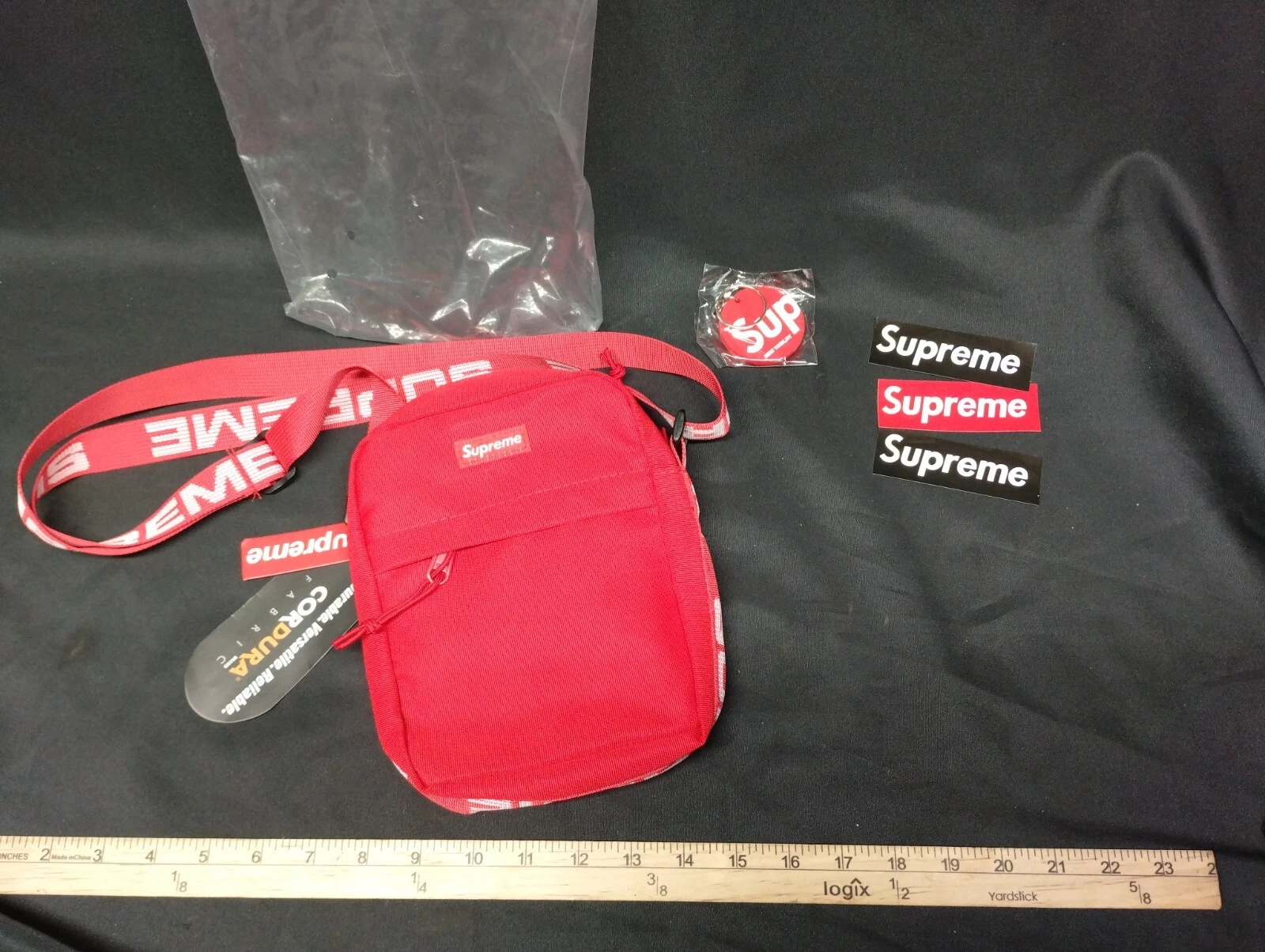 Sac Supreme Over Shoulder Man Murse Rouge