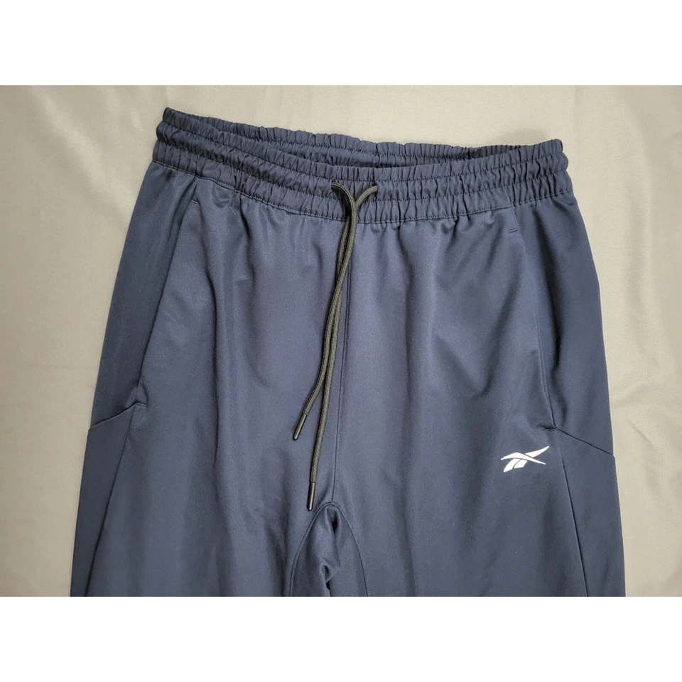 Pantalones Reebok para mujer pequeños S jogger tiro medio cónicos cremallera logotipo azul Foto 2 de 4