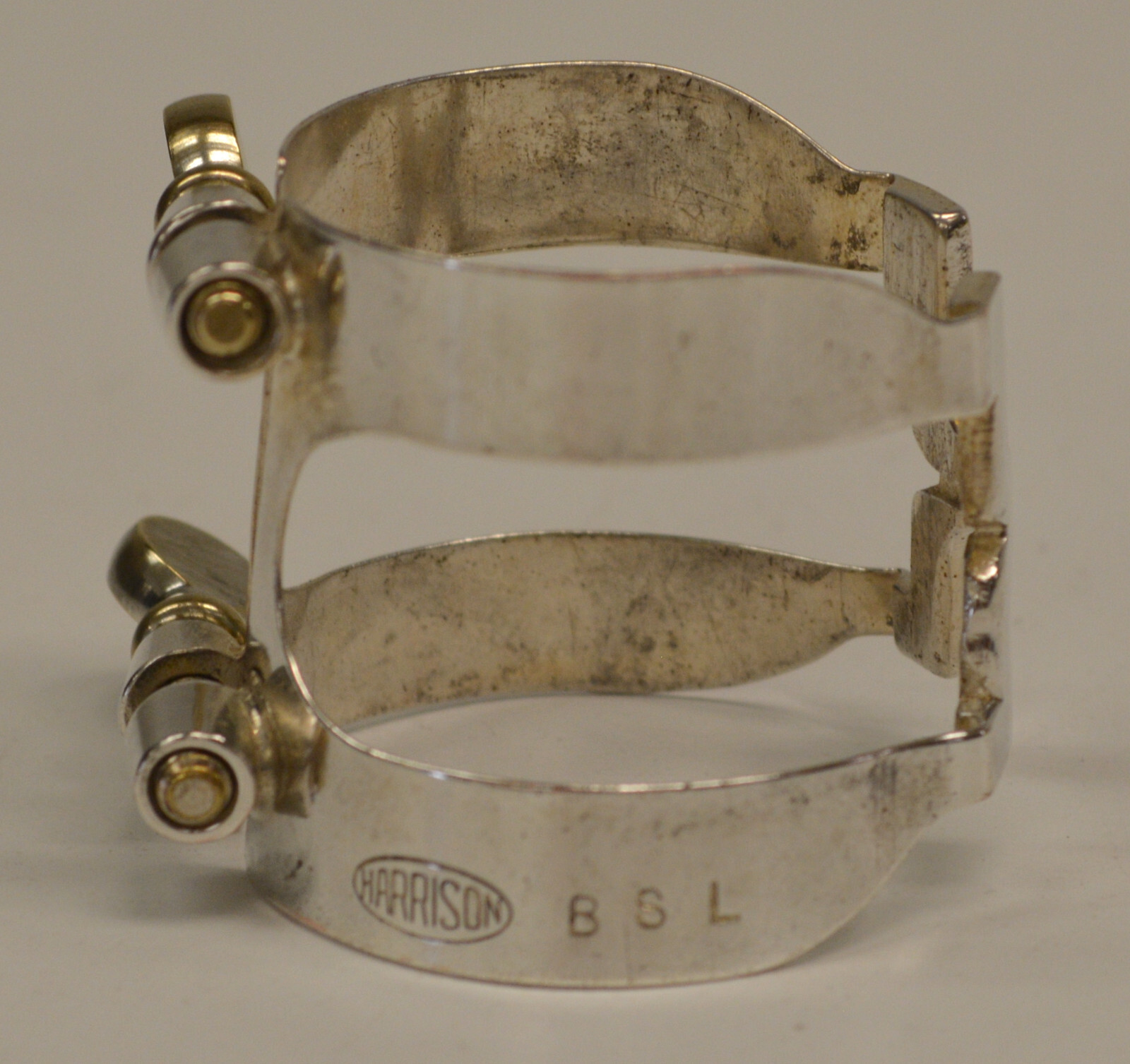 USED VINTAGE HARRISON BARI SAX LIGATURE W/PATENT REFERENCE, MARKED BSL