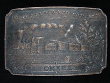OB21113 VINTAGE 1970s WELLS FARGO AND COMPANY OMAHA BRASSTONE BELT BUCKLE