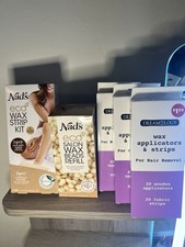 Lot of wax hair removal strips, applicators and beads