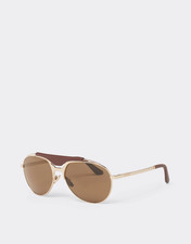Lunettes de soleil Ferrari en métal doré et cuir avec verres polarisants marron.