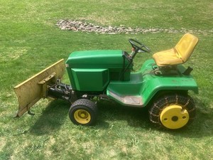 John Deere Model 318 tractor with plow & Onan P218G engine