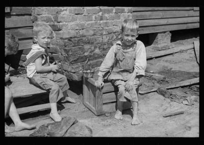 Son of a farmer on Wolf Creek Farms project who has not yet been m - Old Photo 1