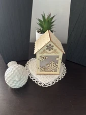 Lit Bird House And Ceramic Bird