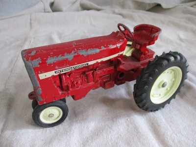 red metal tractor toy