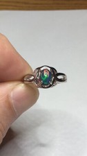 107B- .60ct Genuine Ethiopian Welo Opal set in a Size 7 Sterling Silver Ring