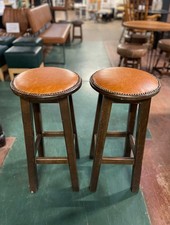 Pair of traditional pub bar stools with tan leather seats