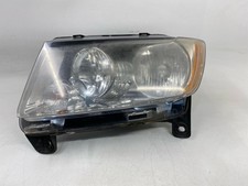 Used Left Headlight Assembly fits: 2012 Jeep Grand cherokee halogen Laredo Left