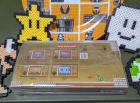 Excellent condition Super Mario Game & Watch (Nintendo) with bonus item.