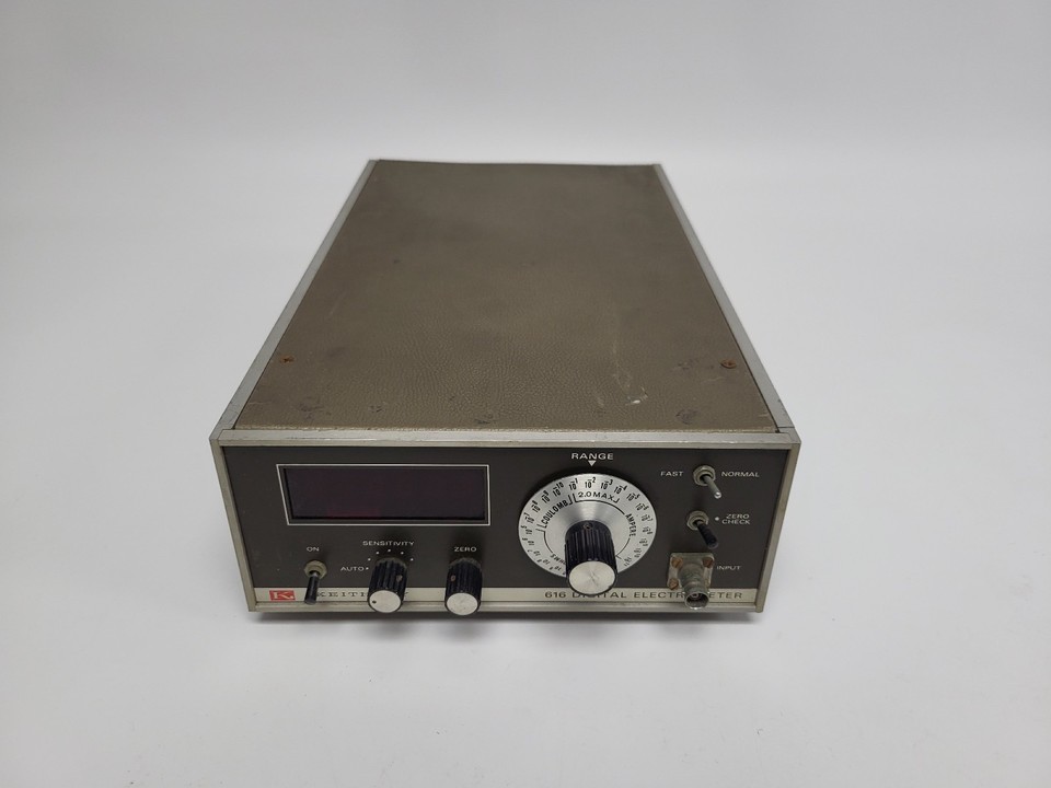 A 1970s Keithley 616 Digital Electrometer that still powers on — a chunky, knob-covered piece of retro lab tech that looks straight out of a Cold War research facility.