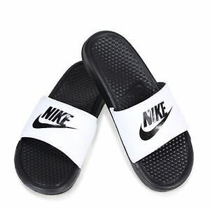 white and black nike slippers