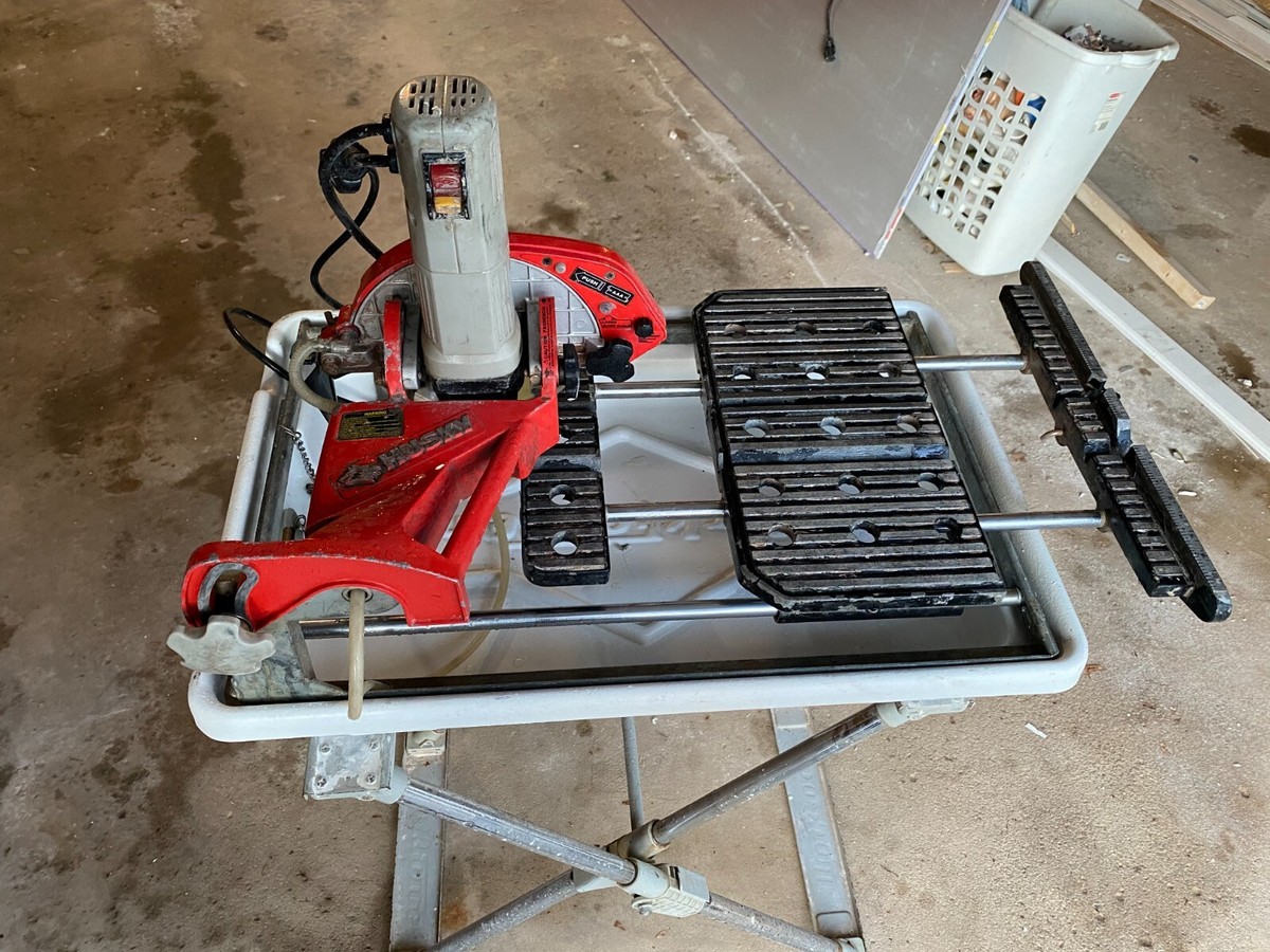 Husky wet saw ( 7 In. Wet Tile Saw w/ Laser and Stand ) - $275