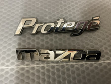 2000-2001-2003-2004 Mazda Protege Rear Trunk Emblem Oem 2000-2001-2003-2004 Mazda Protege Rear Trunk Emblem Oem
