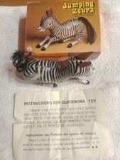 Vtg. Wind up Tin Jumping Zebra Works Great in the box Never used. With Key