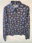 Brown and blue County Seat ladies shirt size M with floral print, front buttons, and “Made in USA” label on neckline.