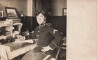 RPPC YOUNG US ARMY SOLDIER SEATED AT DESK c1910 REAL PHOTO POSTCARD 070626 V — photo 1
