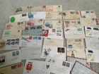 Box full of first day covers. Stamps Australian and overseas. 100+