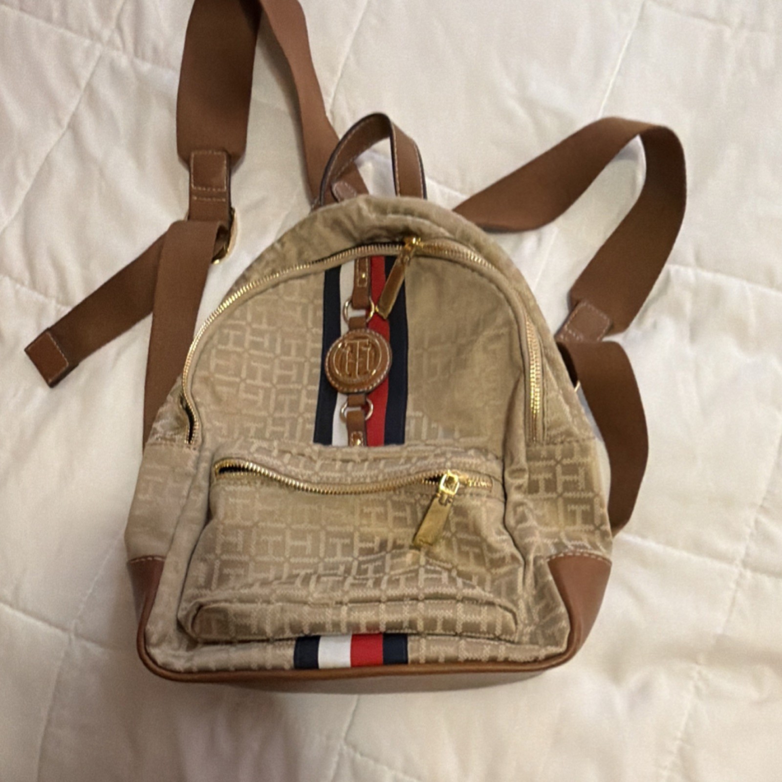 Tommy Hilfiger Beige Logo Backpack with Striped Accent Gold Hardware Brand Charm