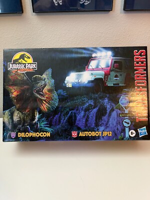 Hasbro Transformers Crossover Jurassic Park Dilophocon and JP12