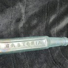 CASTORIA Embossed Clear Glass Medicine Bottle w/ Iridescent Finish — photo 1