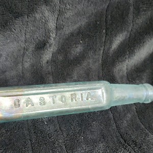 CASTORIA Embossed Clear Glass Medicine Bottle w/ Iridescent Finish