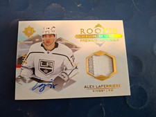 2023-24 ULTIMATE COLLECTION MATERIAL ALEX LAFERRIERE /65 ROOKIE AUTO PATCH