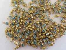 720 (5 gross) Swarovski Rhinestones 24pp Aquamarine/Brass 2 loop settings.