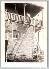 Vtg B&W Snapshot Man On Tall Ladder Working On House Porch Asphalt Siding 1950s