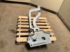 Silver 13-18 RAM 1500 front left driver frame apron radiator support with bent-up design on worn concrete floor.