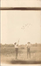 MAN SHOOTING AT BIRDS c1910 real photo postcard rppc hunting hunters