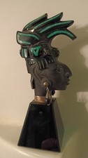 vintage carved obsidian warrior statuetteom mexico with turquoise inlay