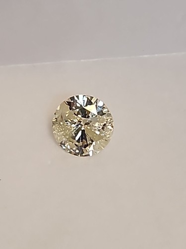 1.06Ct Sparkling Light Yellow Round All Natural