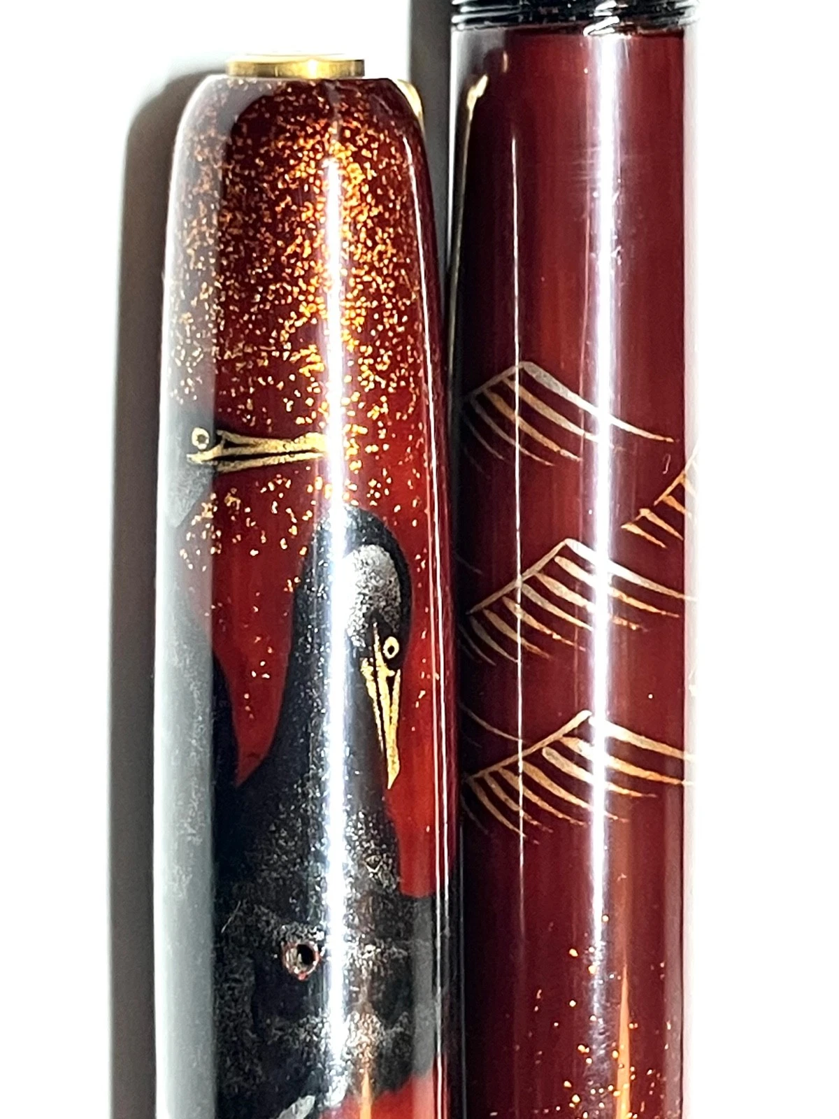 Vintage ink shut off fountain pen with gold and black designs on barrel and body, labeled “HARUYAMA made urushi makie.”